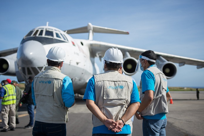 UNICEF staff member during the arrival of a plane with 32 tons of vaccines and supplies to combat COVID-19, at the Venezuela’s main airport on November 23, 2020 in Caracas, Venezuela.

So far this year (October 2020), in Venezuela, UNICEF has distributed over 2.600 tons of supplies, more than US$10 million, to more than 1,332 sites in 23 states.

As November, UNICEF Venezuela received a total of 20.1 tons of health and PPE supplies delivered by air and a total of 168.9 tons delivered by sea, including 7.9 tons of health supplies.
 
This last cargo flight includes vaccines procured by UNICEF to contribute the National Immunization program.  UNICEF has procured the following vaccines: BCG, polio (IPV and bOPV), MMR Vaccine (Measles, Mumps and Rubeola), yellow fever, DTP-HepB-Hib Vaccine (Diphtheria, Tetanus, Pertussis, Hepatitis B and Haemophilus Influenzae) and Td (Tetanus and diphtheria).

All vaccines procured by UNICEF thanks to the contributions of it donors are WHO prequalified and comply with all international quality standards. UNICEF also provides the syringes and security boxes for each vaccines donation to reach for free all vulnerable people and protect them.